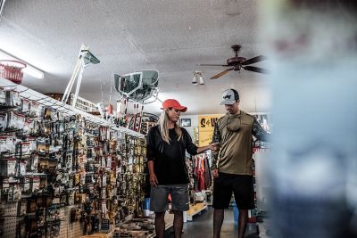 Woman and Man in Fishing Gear Shop