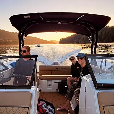 family smiling on boat