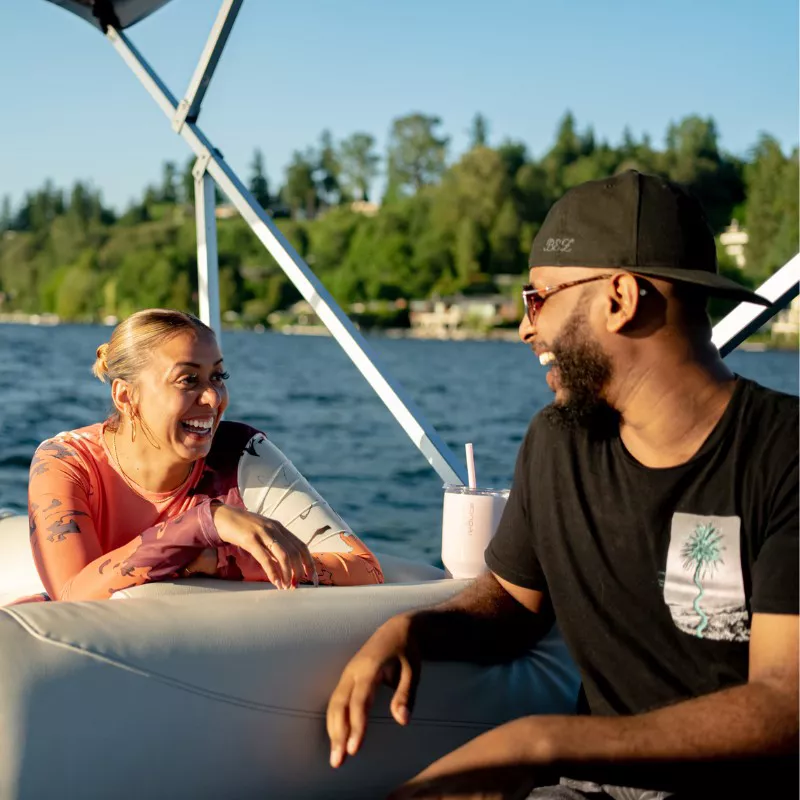 friends laughing on boat
