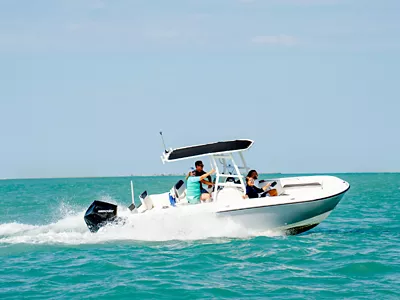 friends enjoying a sunny day on a boat