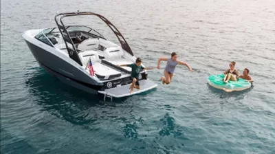 father and kids on boston whaler