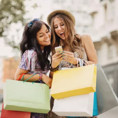 women shopping and looking at phone