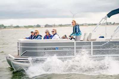 friends on a pontoon in lewes ferry terminal marina