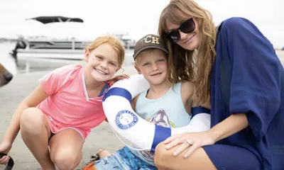 family dining by the water