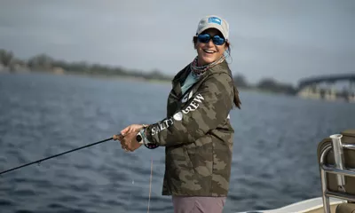 woman fishing off dock in st. augustine