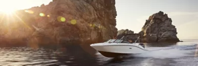 Friends on boat at sunset