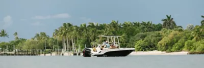 Family on the boat at a sandbar