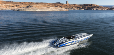 blue black white striped boat water mountains