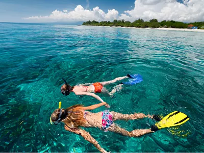 two women snorkeling near little harbor marina