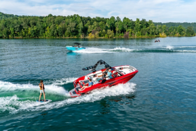 Wakeboarder Behind Heyday Wake Boat, Starboard View, Boat Underway