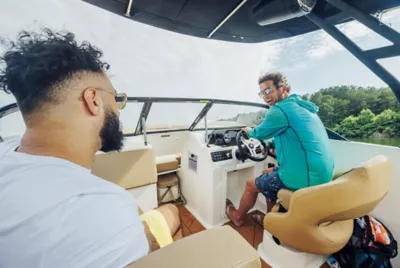 two men in the interior of a D20 deck boat