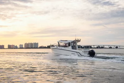 Trophy T25 Pilothouse overnight running at sunset