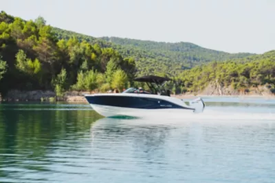 V20 bowrider boat running with a sunshade up