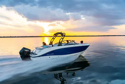Black V20 Bowrider boat running on a lake