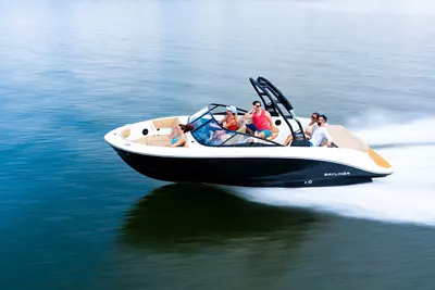 Black V22I Bowrider boat running on a lake