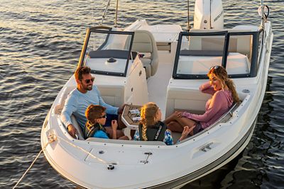 Family of 4 in Bow of 210 Vantage Dual Console Boat, Front View, Boat Anchored