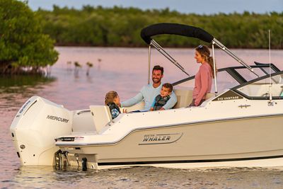 Family of 4 on Boston Whaler 210 Vantage Dual Console Boat, Starboard Back View, Boat Anchored