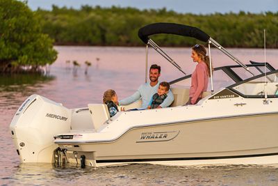 Family of 4 on Boston Whaler 210 Vantage Dual Console Boat, Starboard Back View, Boat Anchored