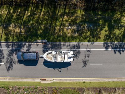 SUV Towing Boston Whaler 210 Vantage Out of Water