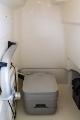 Porta potti with deck pump-out