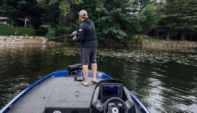 fishing bass boat silhouette Triton outboard motor - SuperStock