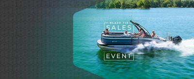 A Harris pontoon boat with four people aboard is shown mid-journey on a lake, with a "Black Tie Sales Event" graphic overlay.