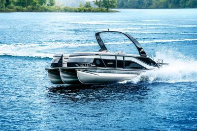 Harris Grand Mariner Pontoon making a sharp turn in the water with a large wake in the back.