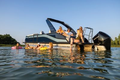 Harris Pontoon Boats Grand Mariner 270 SLDDH featuring a family and friends onboard for a evening cruise.