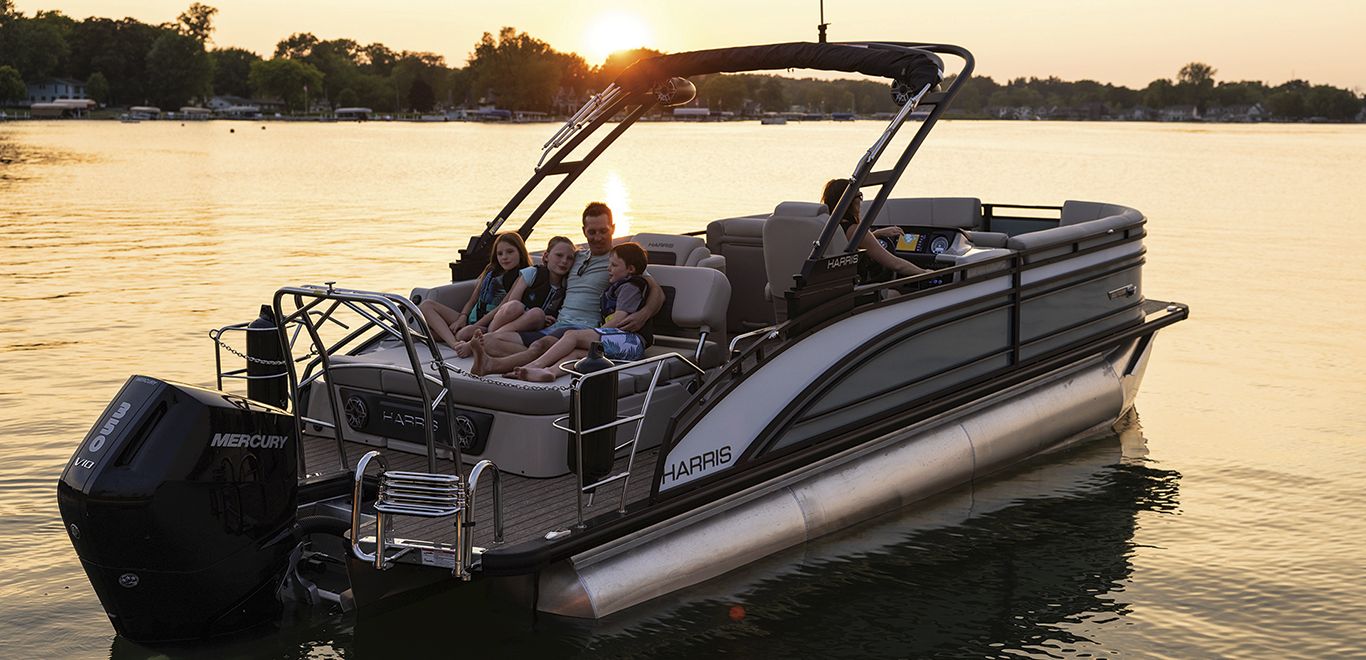 Family lounging on a Harris Pontoon boat