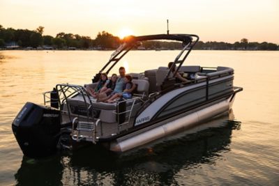 Family lounging on a Harris Pontoon boat