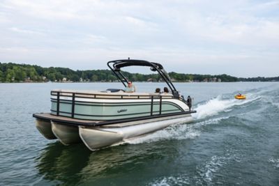 Harris Solstice 250 Pontoon tubing on the water