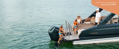 Child climbing up the ladder on a Harris Crowne 250.
