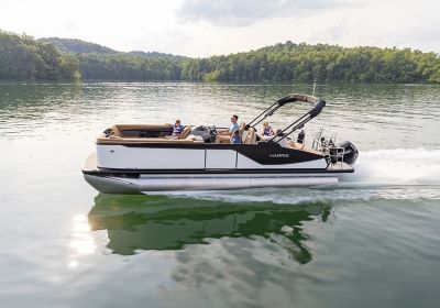 Family riding in a white Harris Sunliner 250 SLDH.