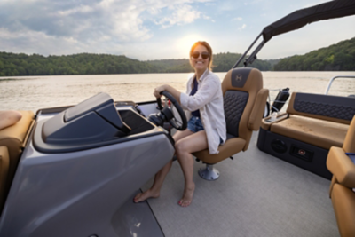 Women lounging on a Harris pontoon boat. 
