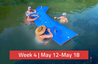 Friends enjoying the Float-N-Fold Water Mat while on the water. There is a text overlay saying, "Week 4 | May 12-May 18."