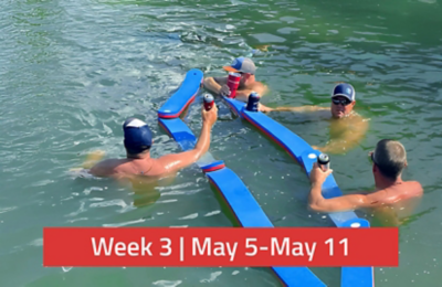 Friends enjoying drinks on the Float-N-Fold Water Chain while on the water. There is a text overlay saying, "Week 3 | May 5-May 11."
